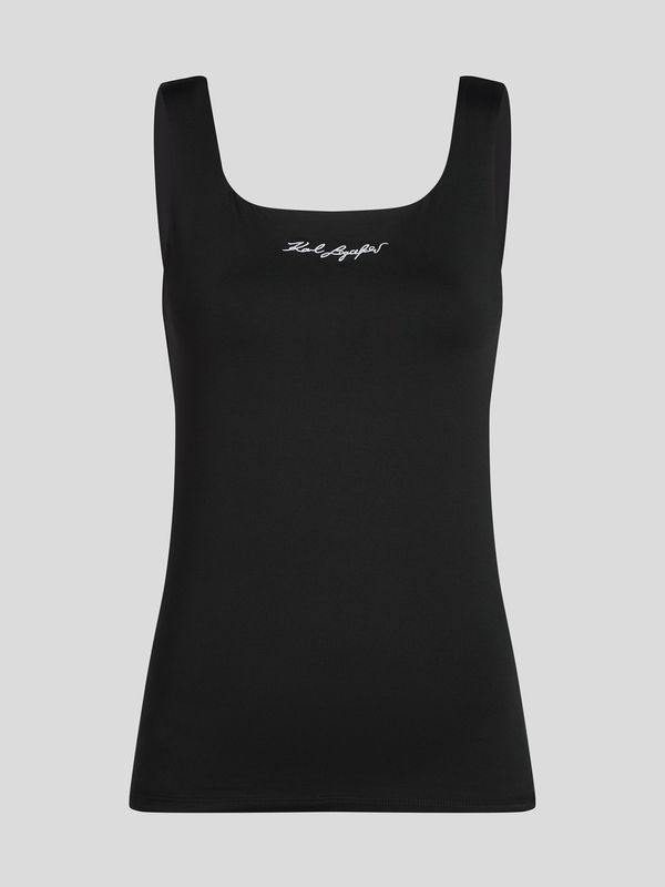 Polera con firma bordada