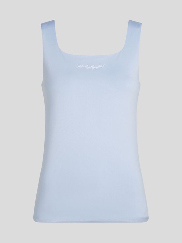 Polera con firma bordada