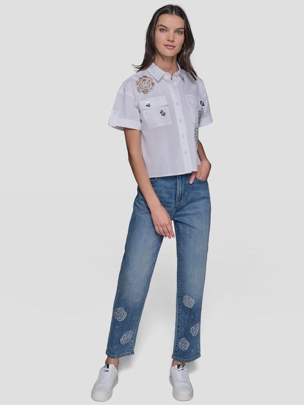 Pantalón denim con motivos florales